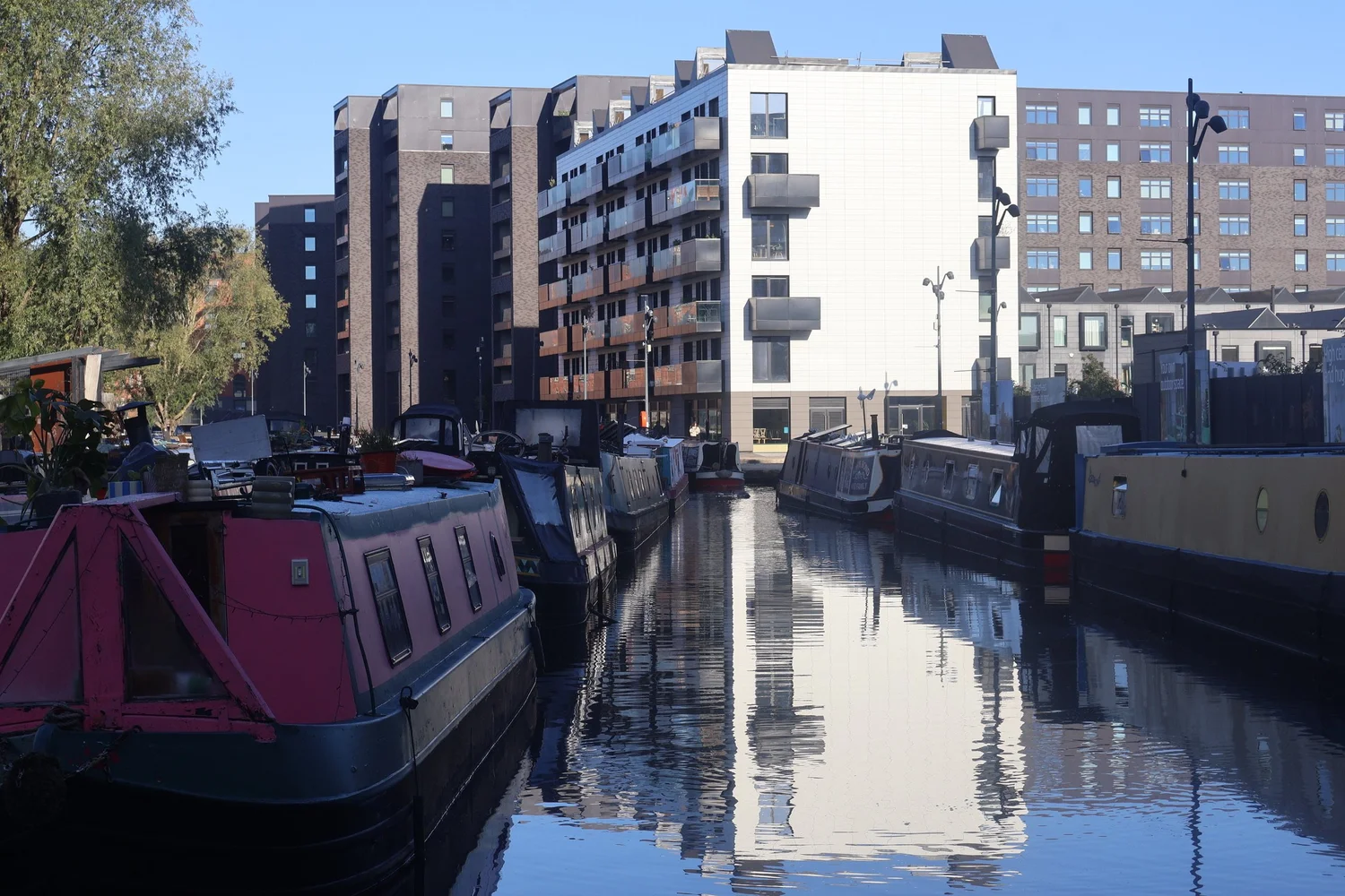 The canals of Manchester today, lined with modern buildings and leisure boats