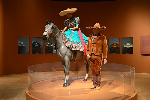 Female and male charro regalia, including sombreros de charro
