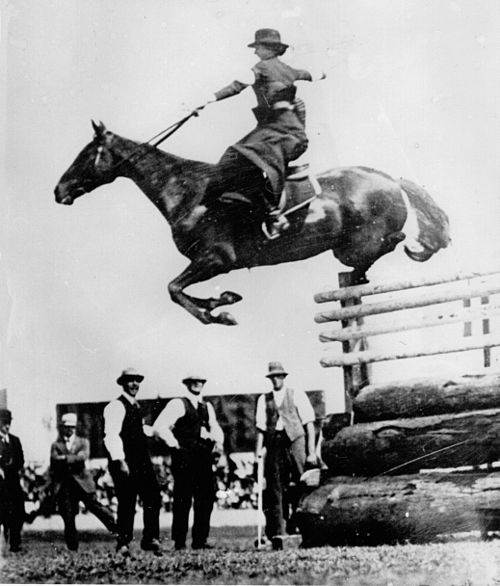 Woman riding in a modern English sidesaddle class